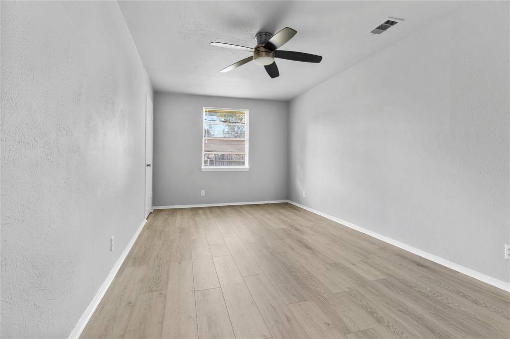 Bright and airy space perfect for a bedroom or office.