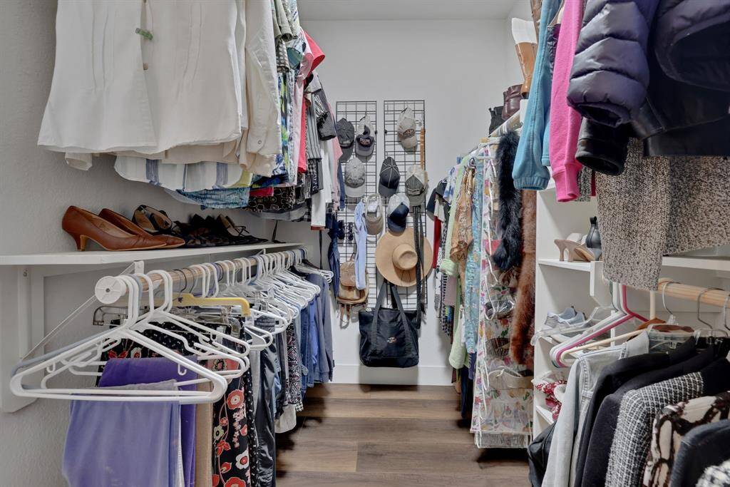 Primary bedroom features a spacious walk-in closet