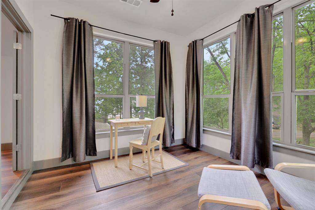 Sun Room offers views of the lake just through the trees
