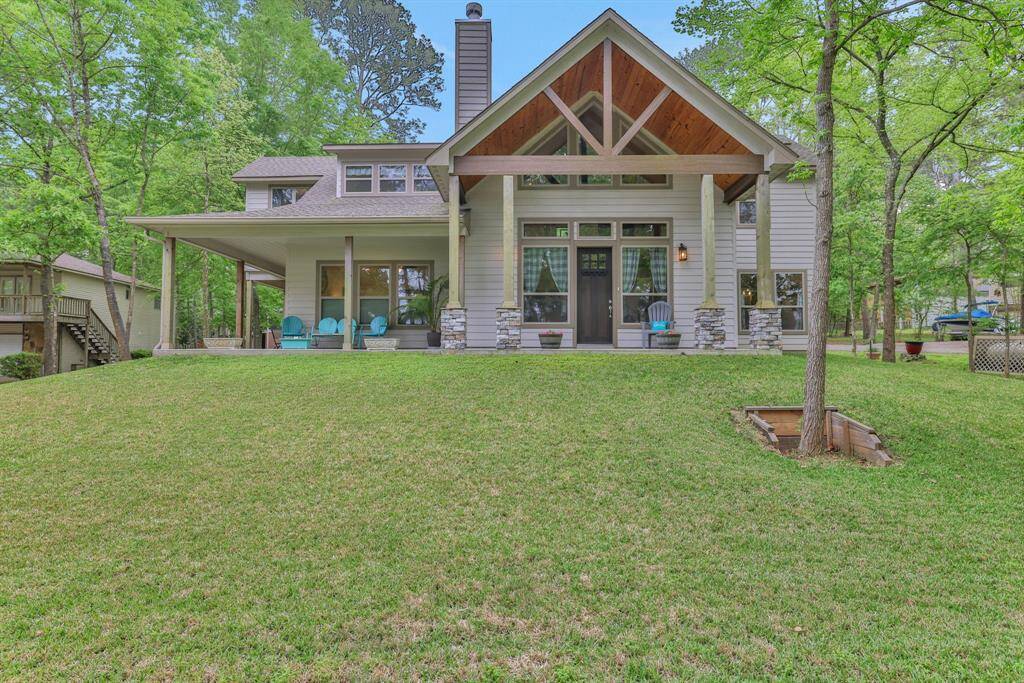 Stunning curb appeal with unique architectural details, including a striking gable roofline and inviting covered porch.