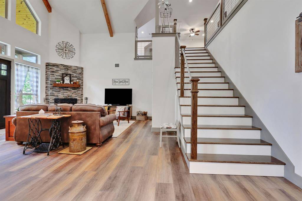The stairs lead to the loft-style upper level that could be used as a second living area, bedroom, or whatever you would like to fit your needs.