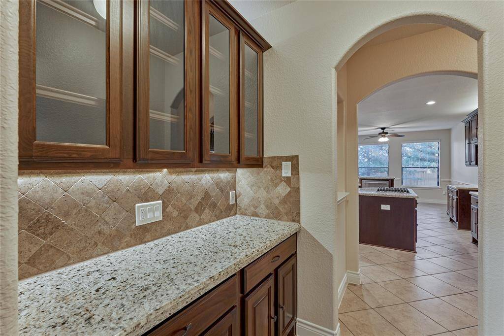 The butler's pantry is perfect for housing all of your stemware and other entertaining dishware.