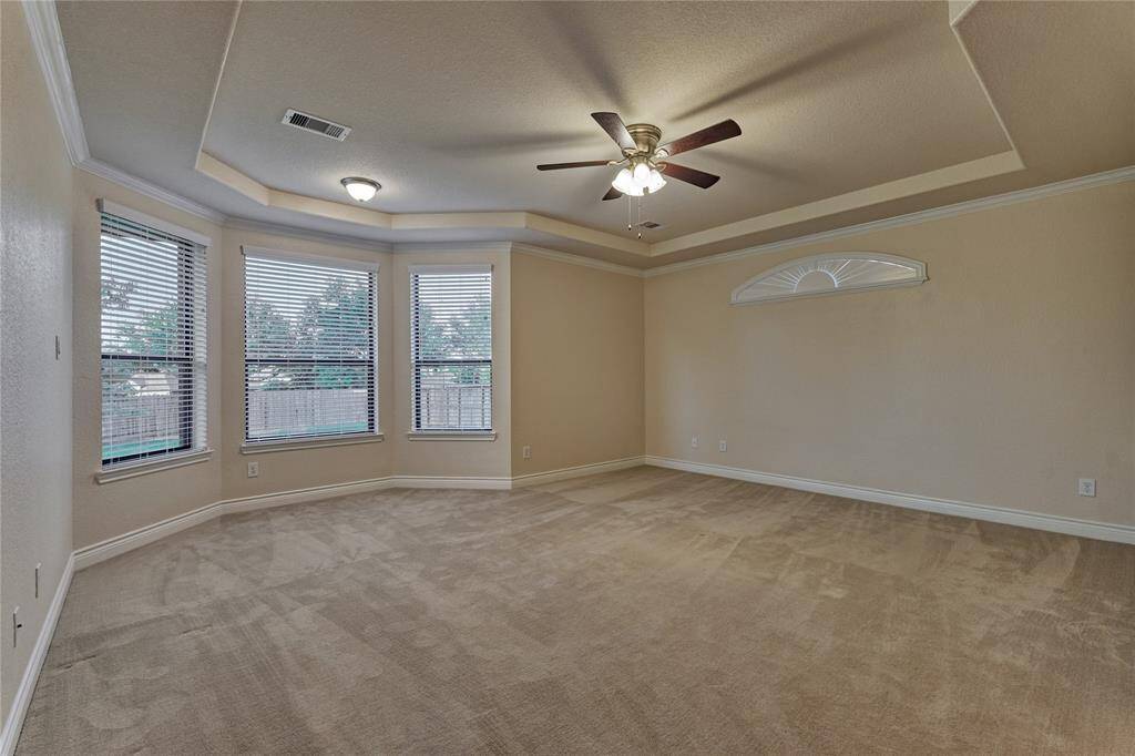 The private owner's retreat offers plush carpeting and a sitting area.