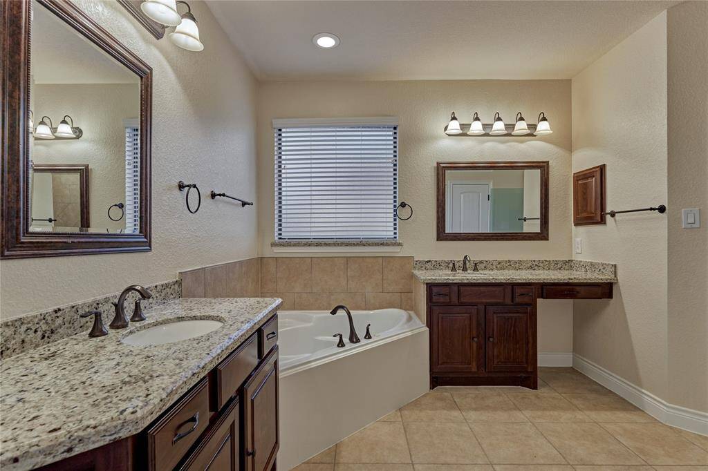 The ensuite boasts of dual vanities with a make-up area, a relaxing soaker tub and a walk-in shower.