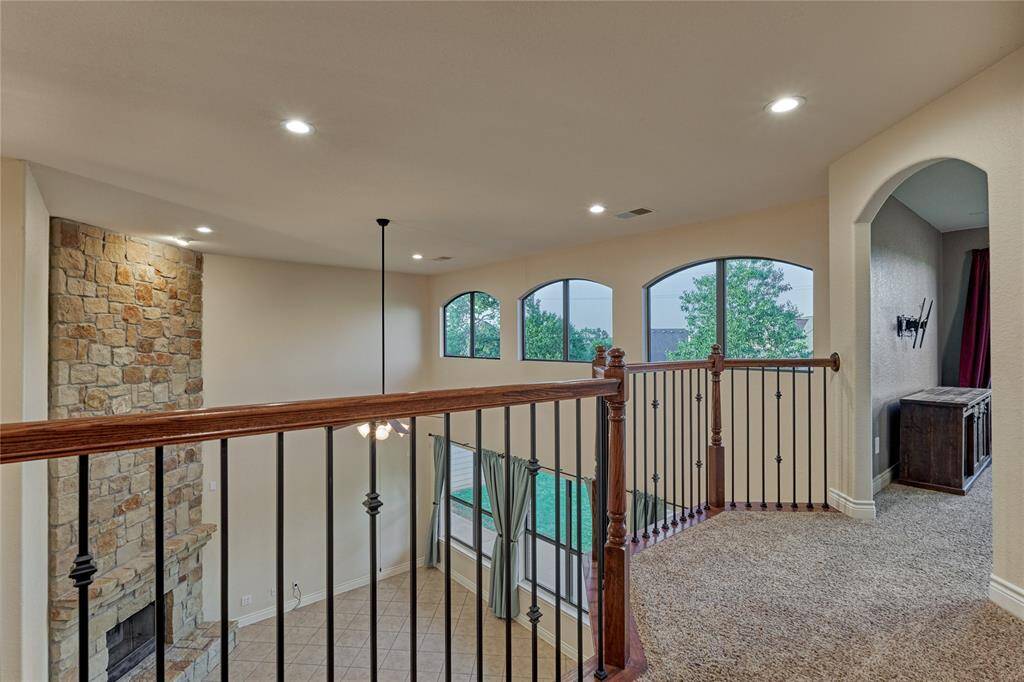 The second floor features 3 secondary bedrooms, 2 full bathrooms and a game room.