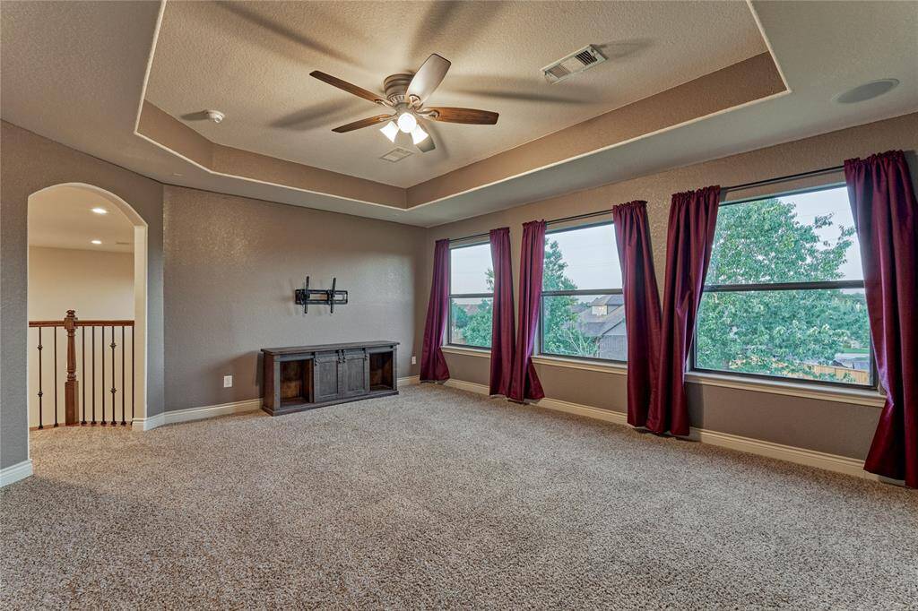 The game room enjoys lovely views of the backyard and beyond.
