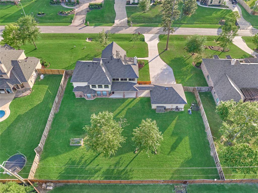This spacious backyard oasis is perfect for kids and pets to enjoy freely.