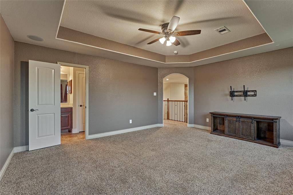 The sizeable game room has access to one of the bathrooms.