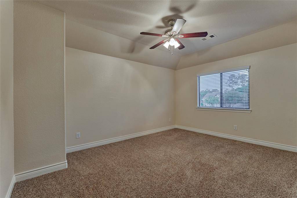 There are 3 secondary bedrooms on the second floor. All of them have ceiling fans and plush carpeting.