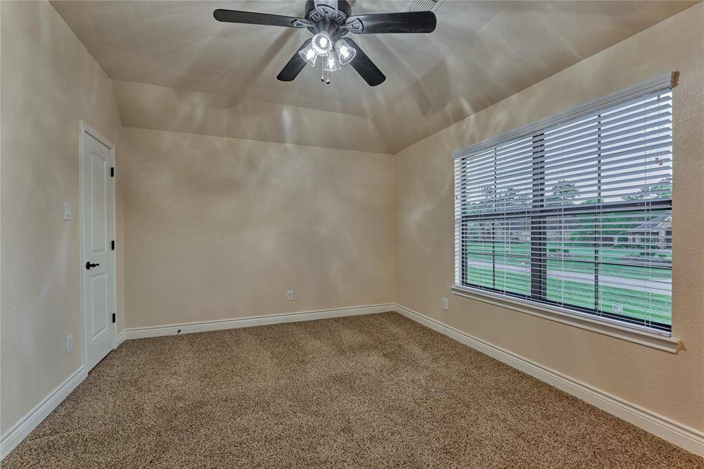 Bedroom #2 with front yard view.