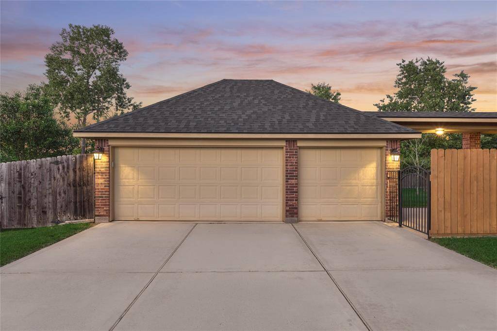 Three car garage and extra space for parking.