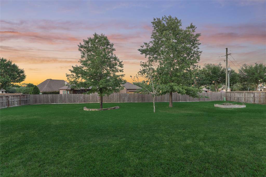 This wide open backyard offers plenty of space to build a pool, start a garden and/or anything else you so desire!