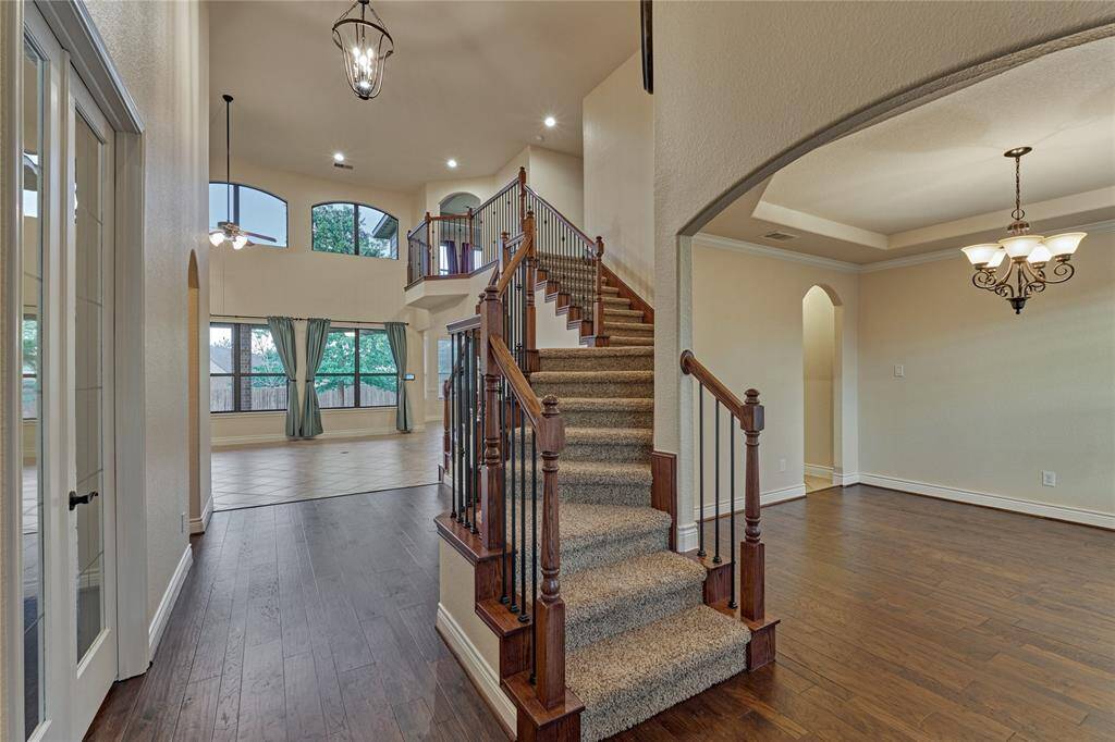 Engineered-wood flooring can be found throughout the foyer, dining and home office.