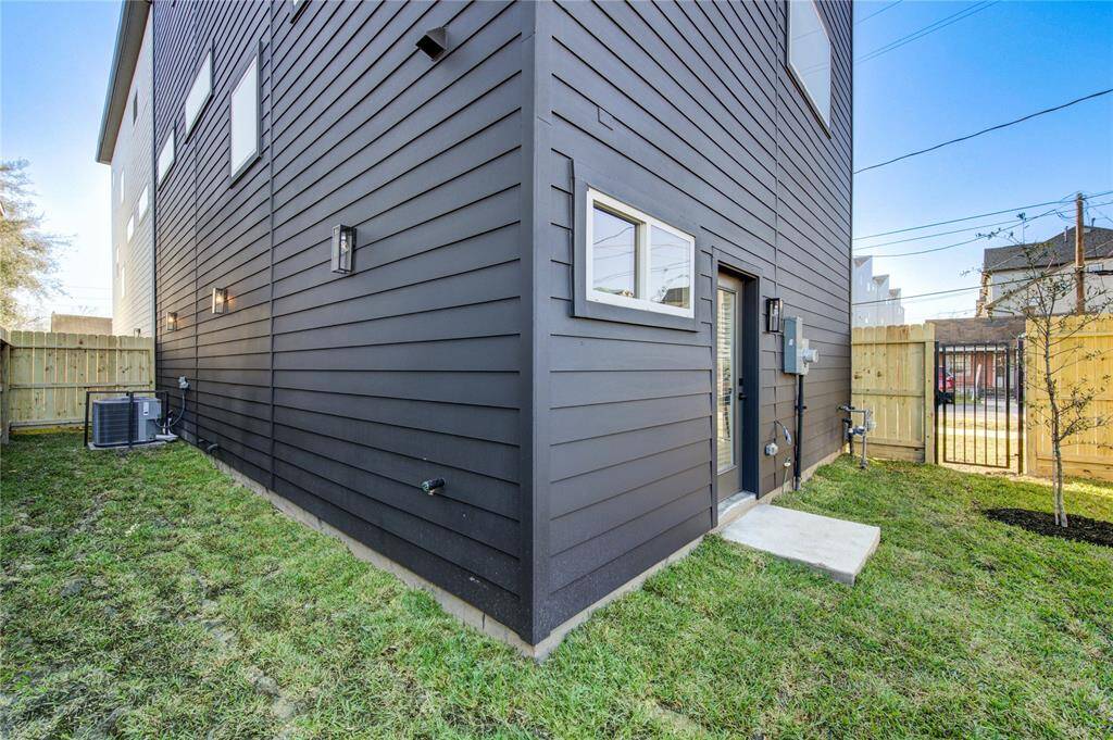 Large private fenced in backyard and side yard accessible from the downstairs bedroom. Ideal for pets! This is the LAST DEVELOPMENT of this kind in East Downtown with the passing of building code changes in November 2024 forcing shared driveway developments with no yards.