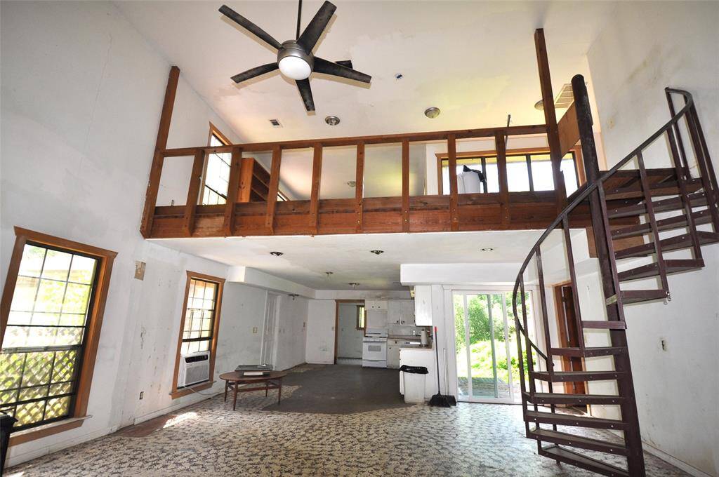Staircase takes you upstairs to a loft/game room area, second bedroom and full bathroom.