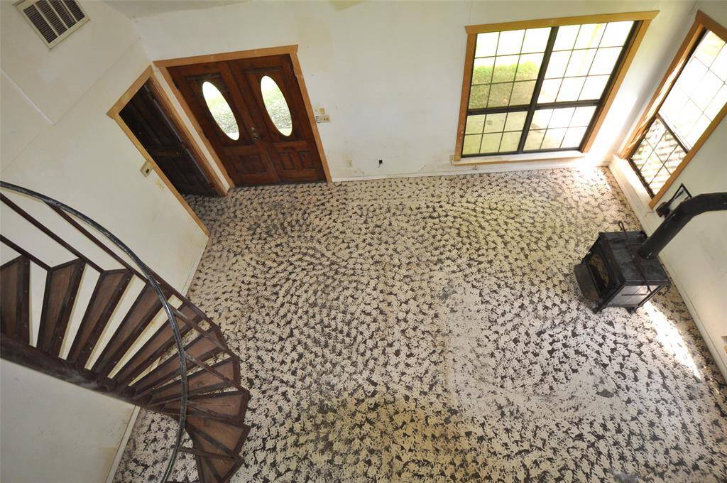 View of living room while standing upstairs.