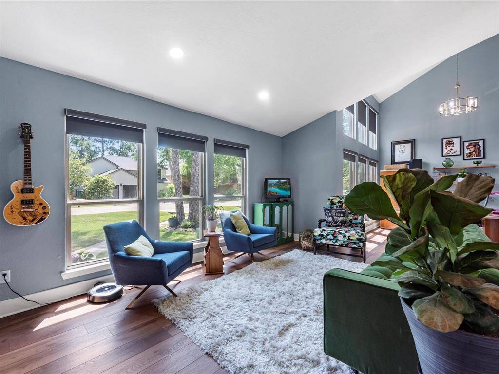 The front living room has shades for the windows and offers a nice place to relax or entertain with guests