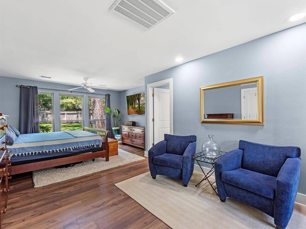 The primary is downstairs and offers a large sitting area