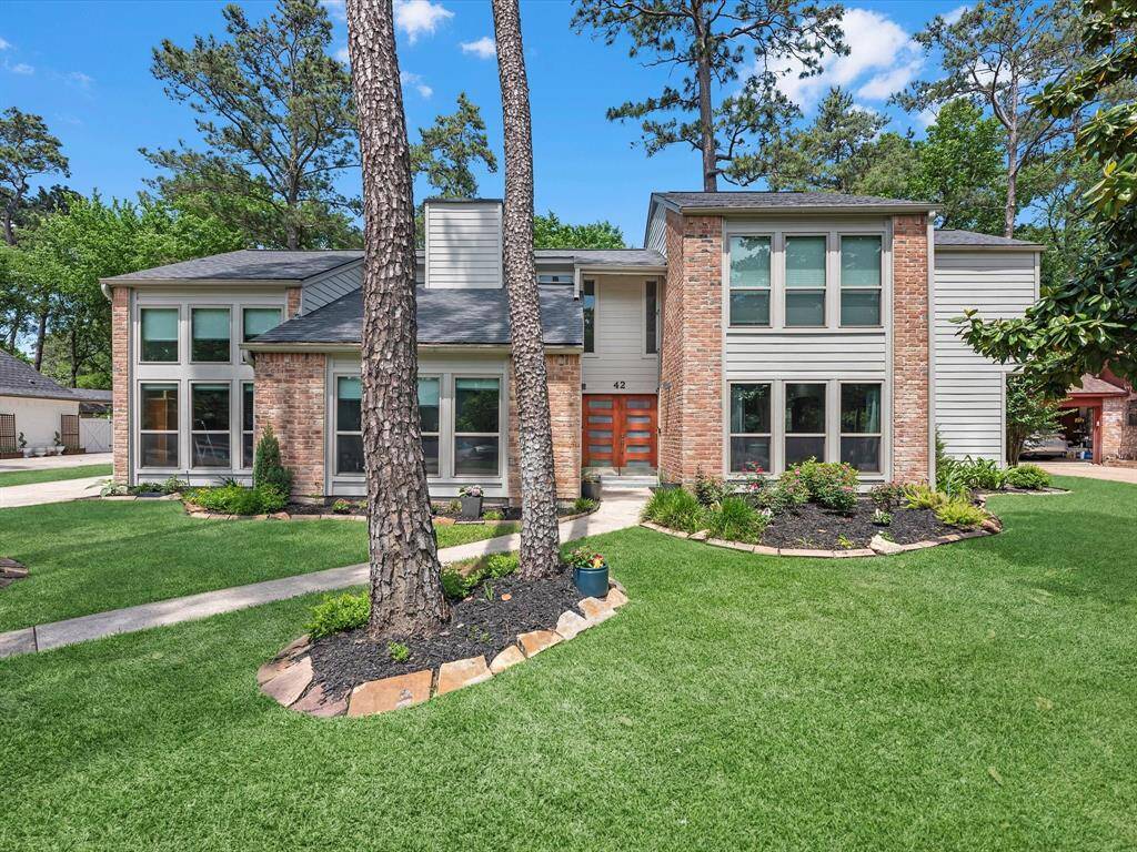 Pretty trees and landscaping are welcoming