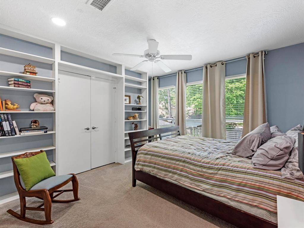 This secondary bedroom has built ins as well