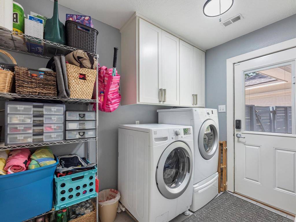 The laundry room has nice storage space and leads out to the pool and garage with covered access
