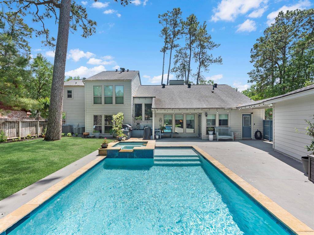 You'll love spending time out here! Relax in the refreshing pool and listen to the waterfall