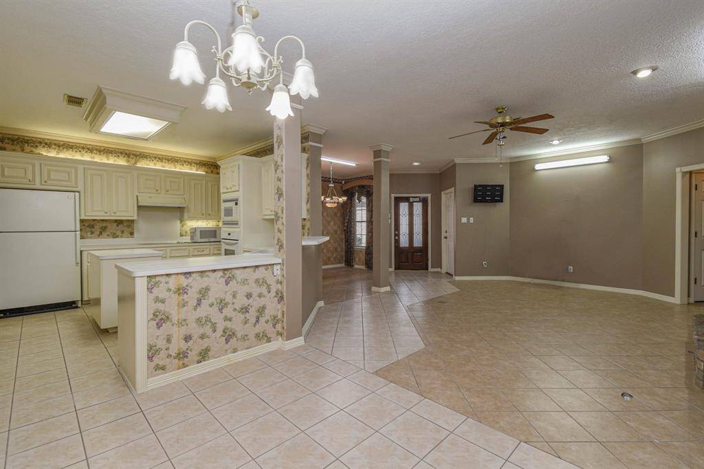 Kitchen Open to Family Area. Eat at Bar.