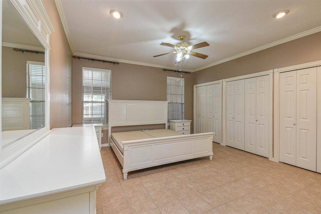 Spacious Primary Bedroom with 5 closets - 2 Walk in Closets & 3 Standard Closets