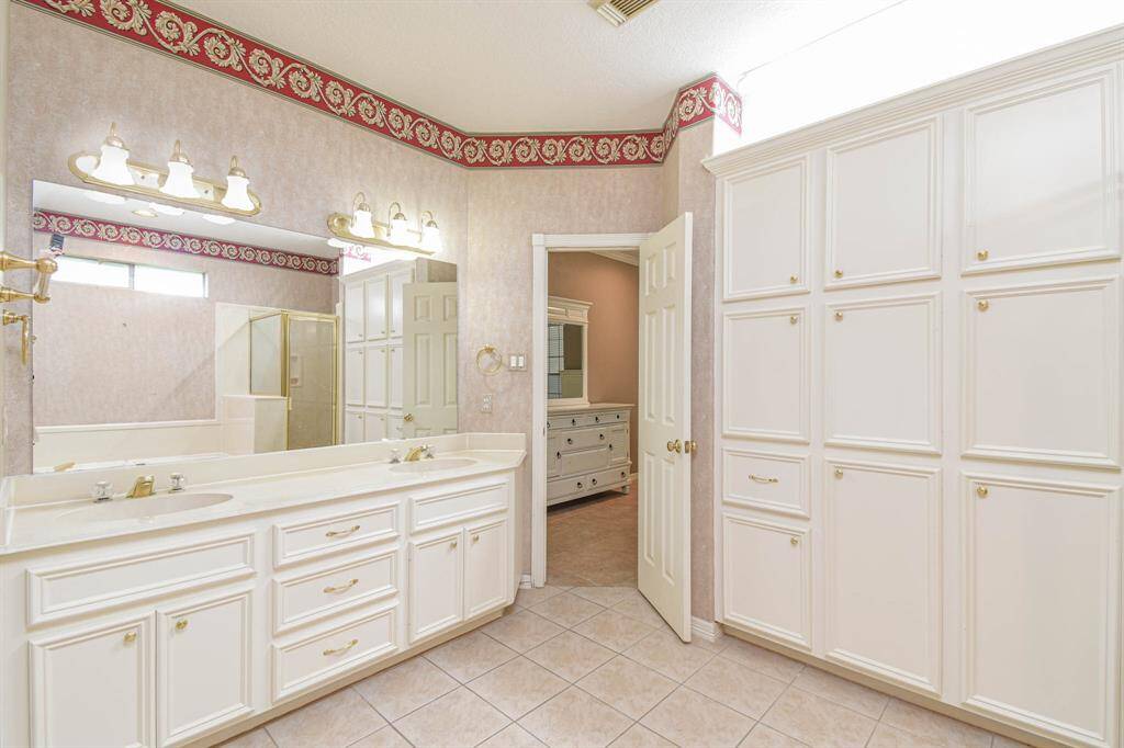Primary Bathroom - Notice the Wall of Built in Cabinetry