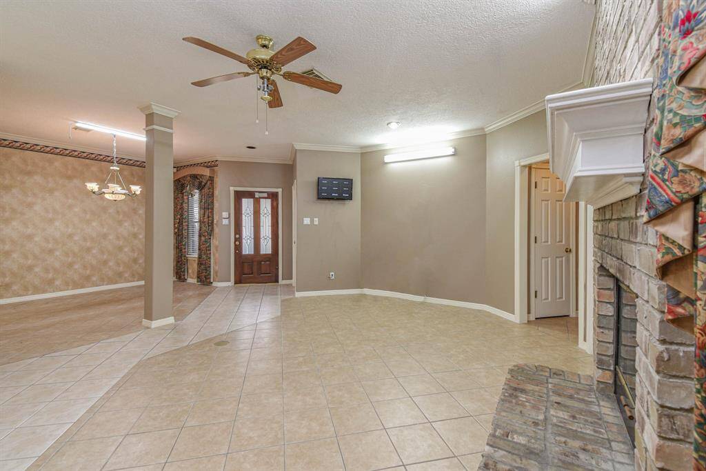 Family Living Area. View towards Front Entry. Formal Dining Area to the Left.