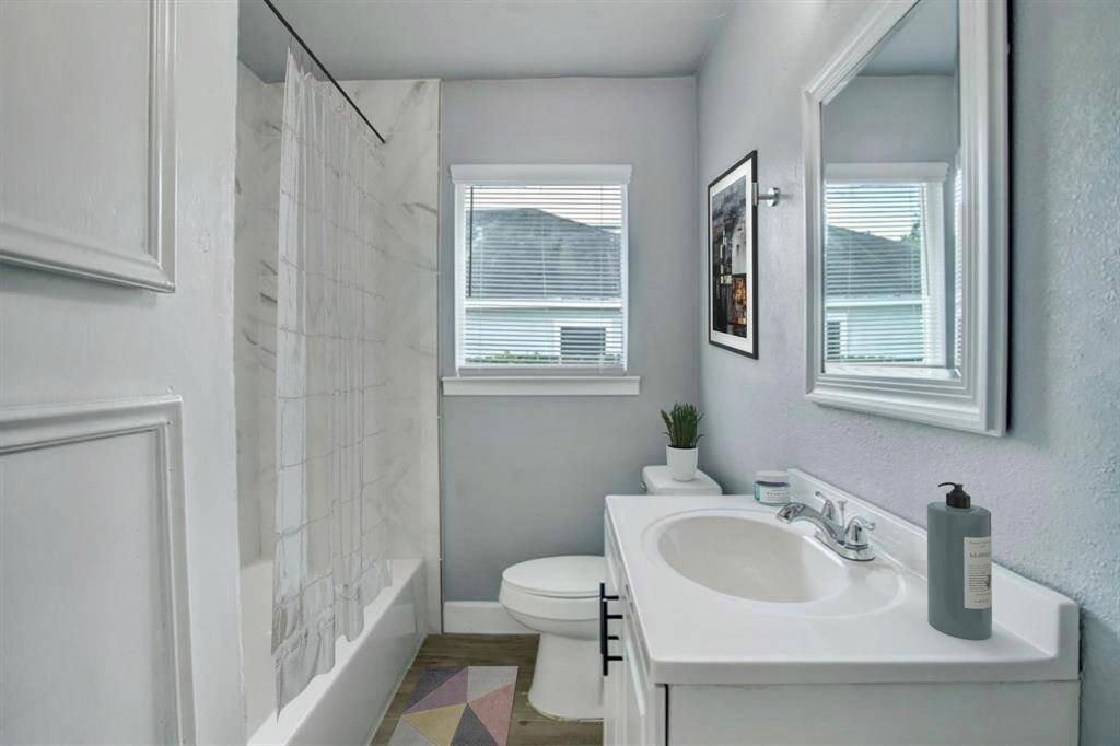 The secondary bathroom includes a full-size tub—ideal for unwinding after a long day or for convenient family use.