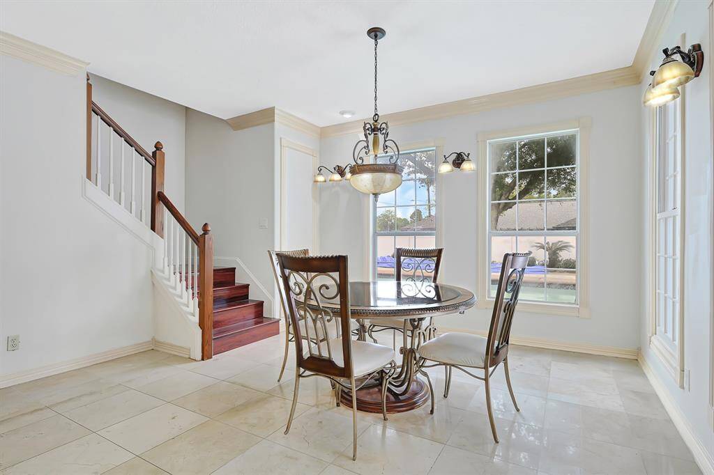Breakfast overlooking pool and 2nd access stair to upstairs