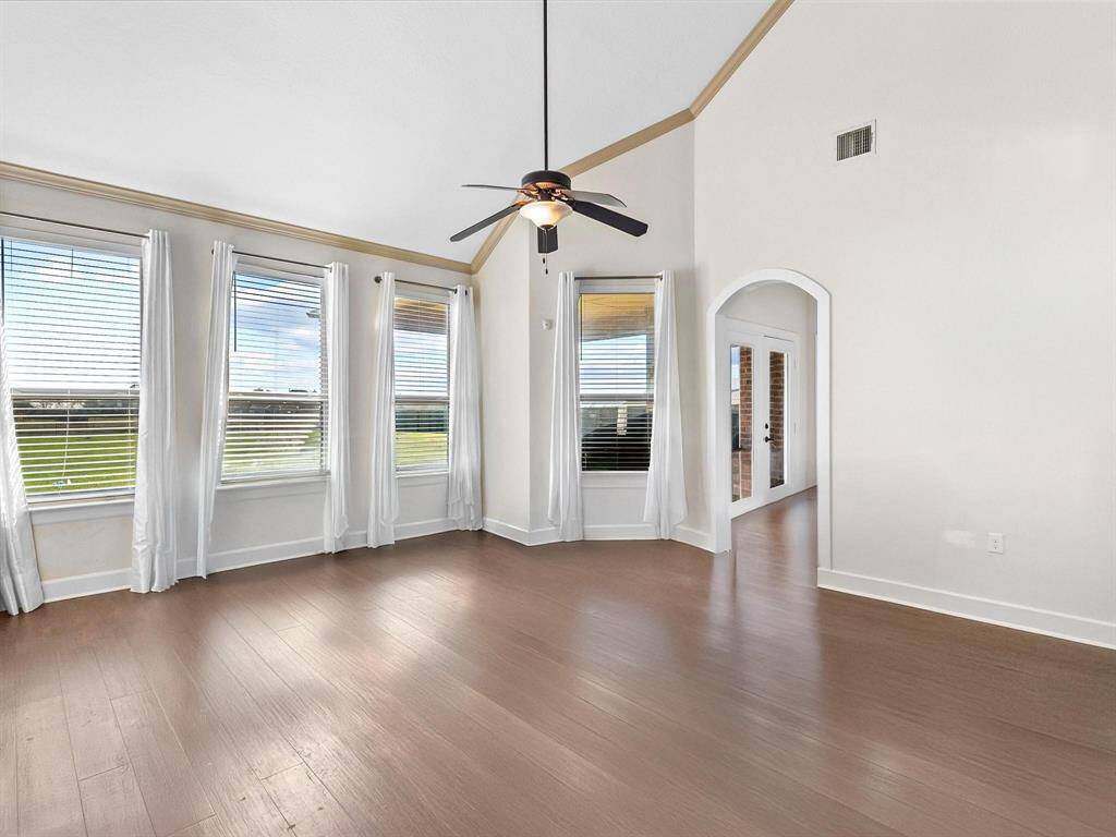 HARD WOOD FLOORS COMPLIMENT THE LIVING AREA