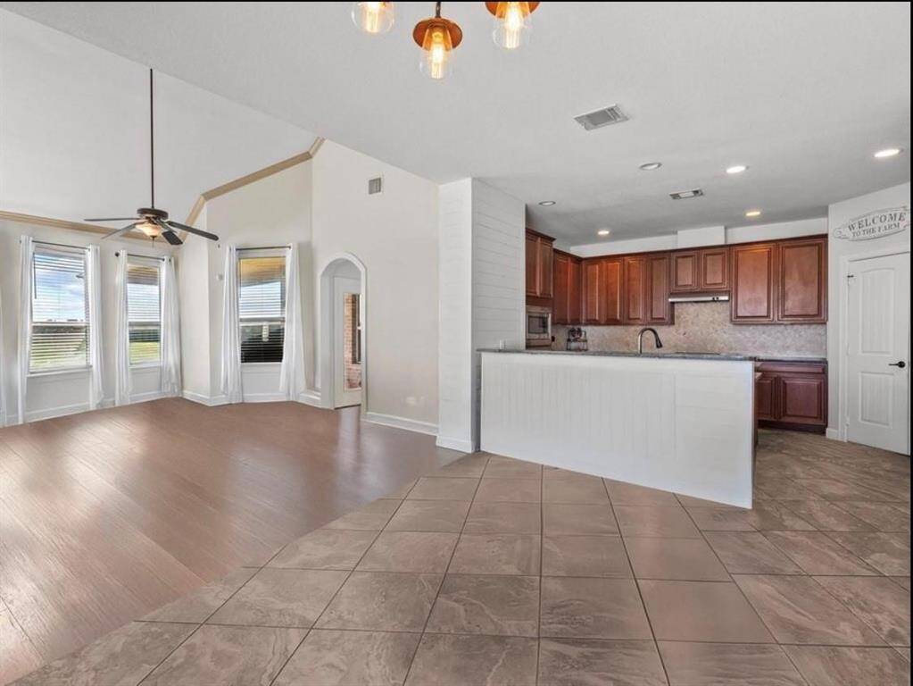 SPACIOUS BREAKFAST AREA WITH GORGEOUS TILE FLOORING