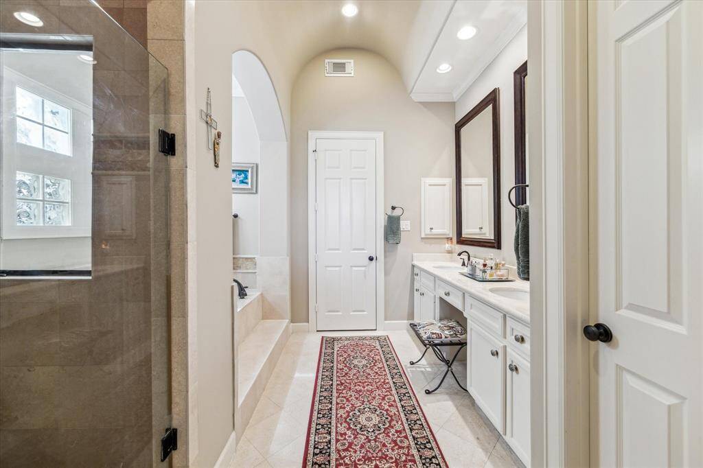 Dual sinks in the Primary Bathroom with walk-in closet and private W/C