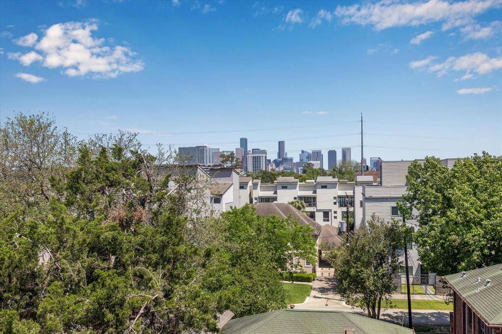 Downtown and treetop views from the Rooftop Deck.