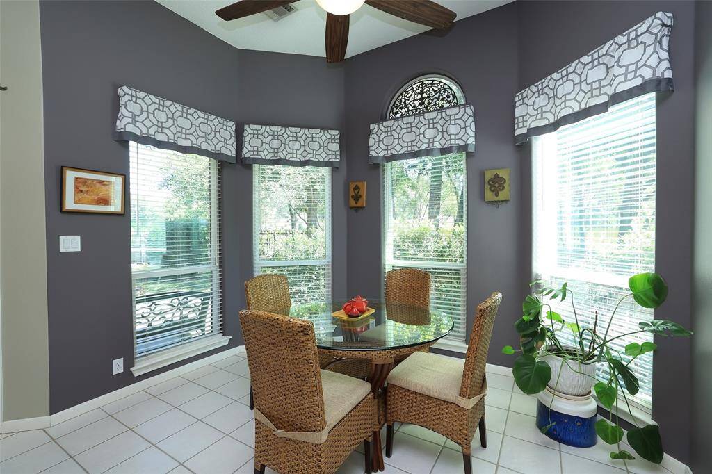 Cozy breakfast room with windows to the backyard.