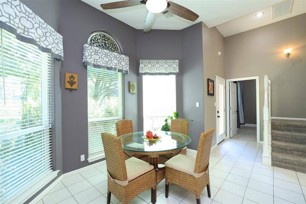 From the light and bright breakfast room is the door to the 2nd ensuite bedroom down. There is also stairs to the upstairs bedroom, full bath, gameroom, and wet bar.