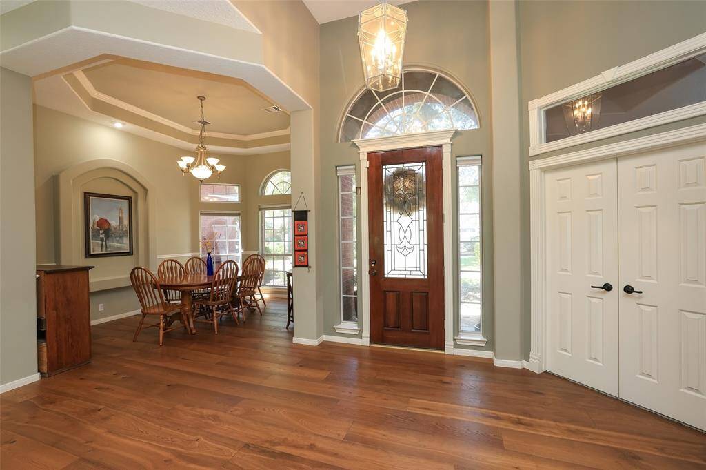 Formal dining room is off the entry and has carpet removed and new wide plank Oak flooring added and continue into the family room
