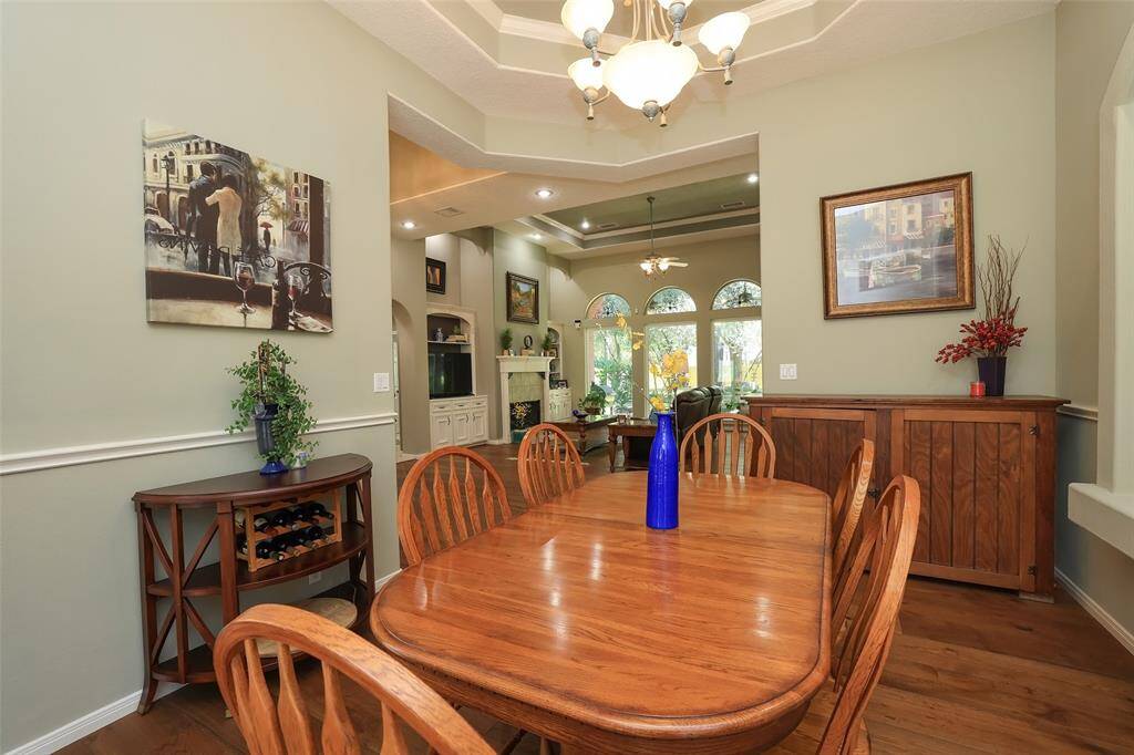 Formal dining area has plenty of wall space for additional furniture pieces