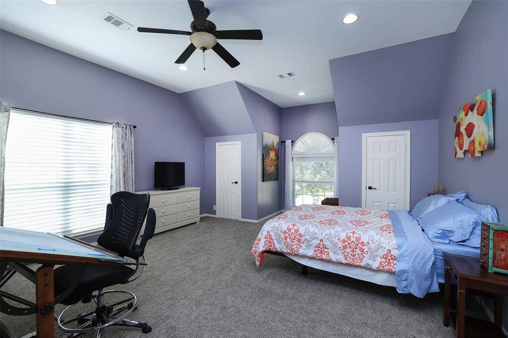 Upstairs is also a huge bedroom with full bath and 3 closets/storage areas.