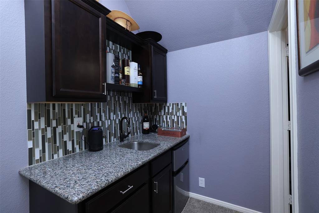 This is the wet bar with plenty of counter space if you wanted to use as additional entertainment space. Could also be a coffee area for guests away from the downstairs.