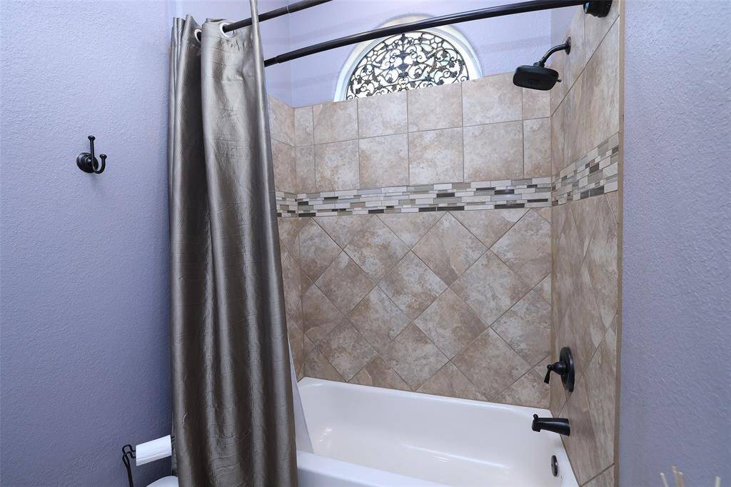 The upstairs full bath has a tub/shower combo.