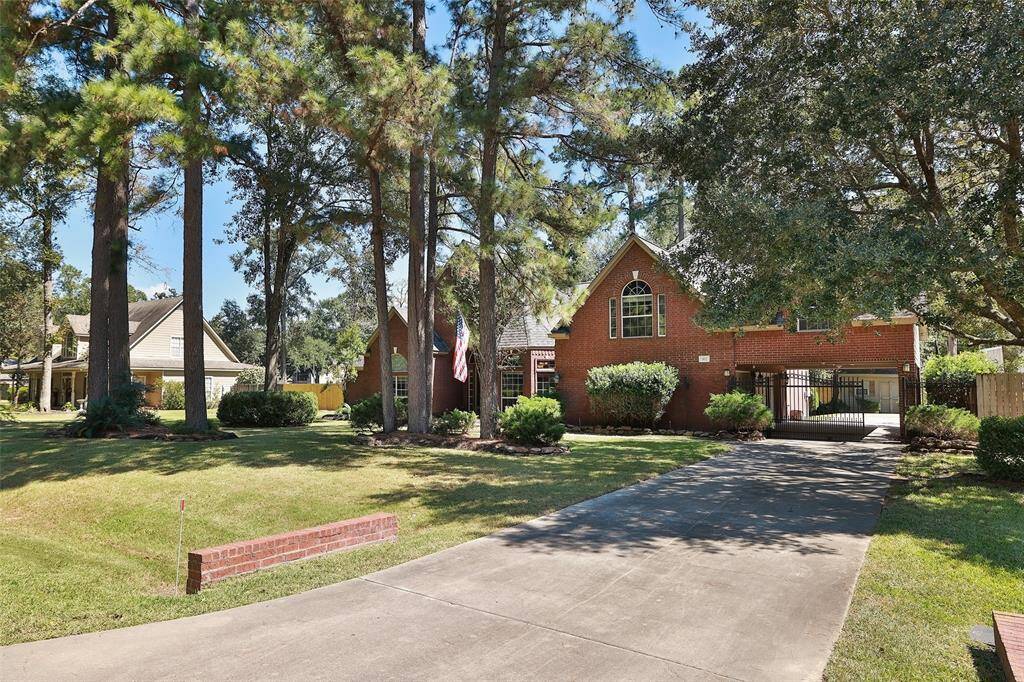 View from the street down the gated driveway