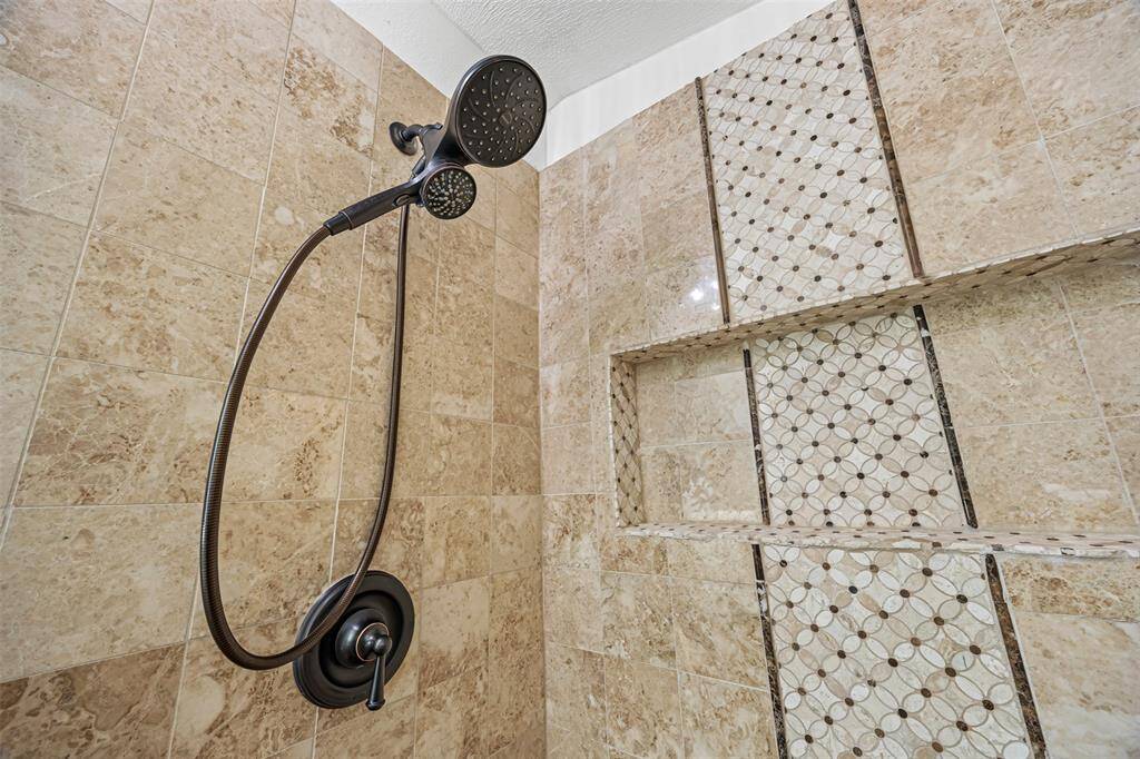 2nd bathroom- All secondary bedrooms feature their own full bathrooms with tub/shower combos and beautiful custom cabinetry
