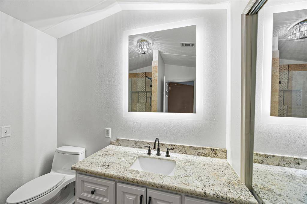 2nd bathroom-All secondary bedrooms feature their own full bathrooms with tub/shower combos and beautiful custom cabinetry