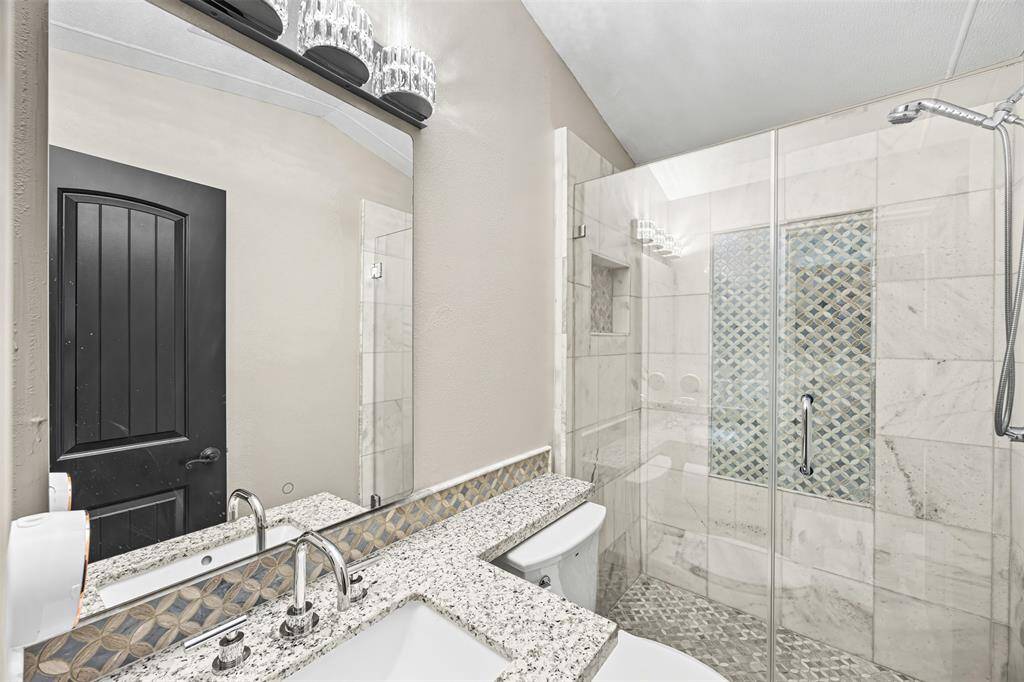 3rd bathroom- All secondary bedrooms feature their own full bathrooms with tub/shower combos and beautiful custom cabinetry