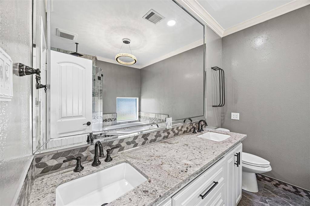 4th bathroom- All secondary bedrooms feature their own full bathrooms with tub/shower combos and beautiful custom cabinetry