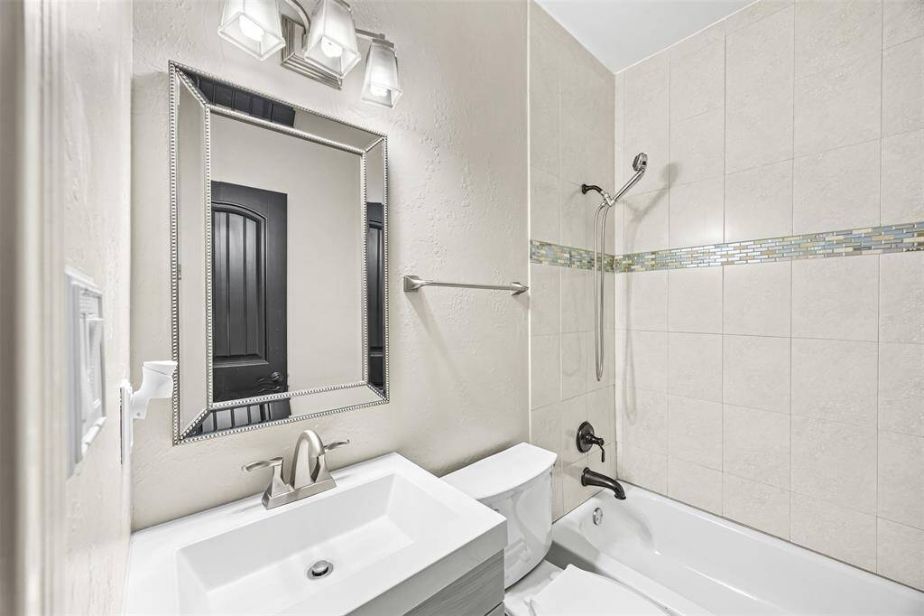 4th bathroom-All secondary bedrooms feature their own full bathrooms with tub/shower combos and beautiful custom cabinetry