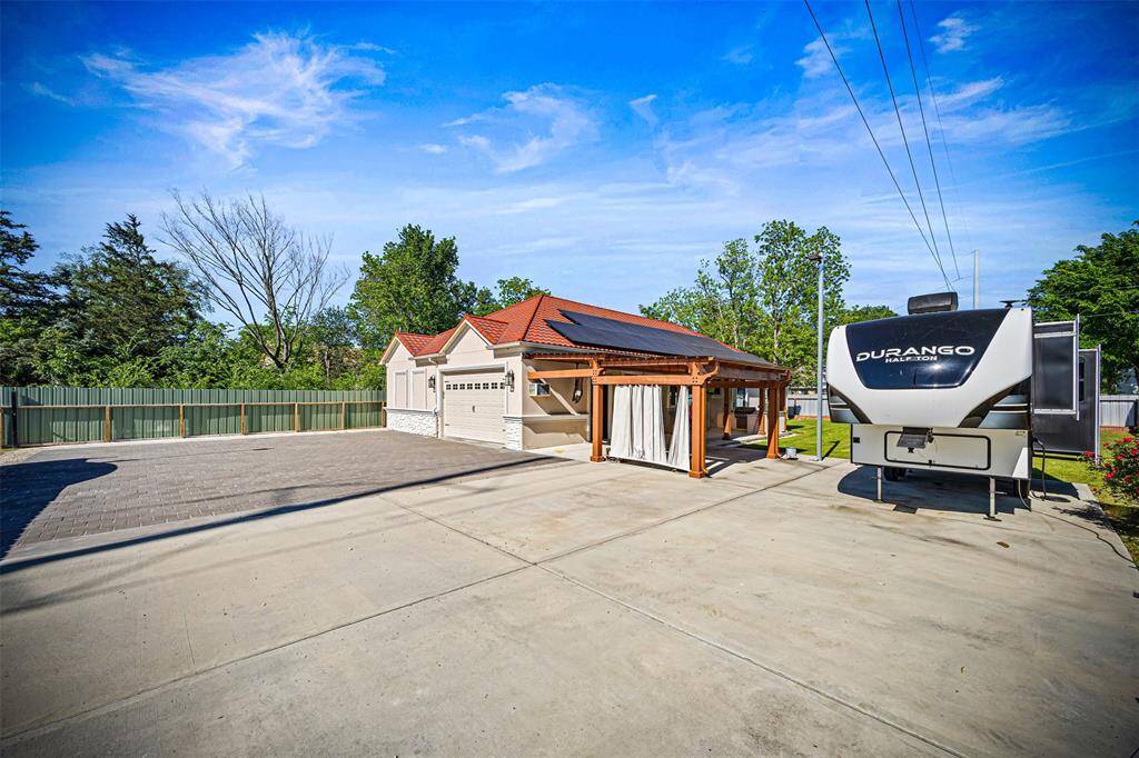 .Concrete driveway topped with 3.5” pavers—strong enough for any truck